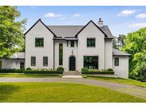 Stunning two-story home with a manicured lawn and lush landscaping at 3773 Randall Se Rd, Atlanta, GA 30339