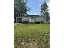 Charming one-story home with lawn and neutral siding at 888 Beecher Sw Ct, Atlanta, GA 30311