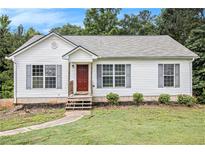 Charming single-story home featuring a well-maintained lawn, neutral siding, and a cozy front porch at 1104 Driftwood Ct, Mcdonough, GA 30252