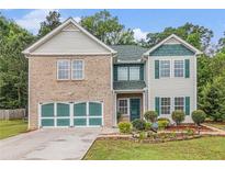 Charming two-story home featuring brick and vinyl siding with a well-manicured front yard at 3210 Avondale Pkwy, Powder Springs, GA 30127