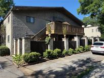 Charming building featuring a deck and beautiful landscaping, complete with a parking area at 375 6Th Ne St # 5, Atlanta, GA 30308