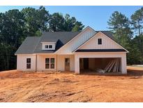 Charming single-story home with white siding and a spacious two-car garage at 610 Presley Farm Pkwy, Rockmart, GA 30153