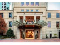 Elegant building entrance with a covered portico and well-maintained landscaping at 3376 Peachtree Ne Rd # 35A, Atlanta, GA 30326
