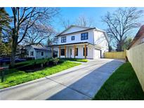A modern, two-story home with a long driveway and well-manicured lawn at 1102 Morley Se Ave, Atlanta, GA 30312