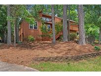 Charming two-story home with natural landscaping and a cozy, wooded setting at 3007 Manning Dr, Marietta, GA 30062