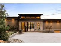 Stunning modern home featuring a unique stone facade, a courtyard, and sophisticated landscaping at 2746 Emerald Dr, Jonesboro, GA 30236
