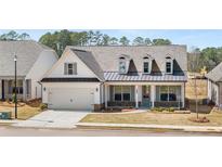 Charming single-Gathering home featuring a symmetrical facade, inviting front porch, and well-manicured front yard at 3772 Tielman St, Snellville, GA 30078