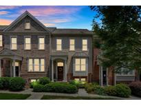 Charming two-story townhouse with a welcoming front porch and well-manicured landscaping at 2281 Millhaven Se St # 18, Smyrna, GA 30080