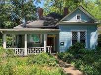 Charming blue home with a cozy front porch and a lovely landscaped yard at 782 Marion Se Ave, Atlanta, GA 30312
