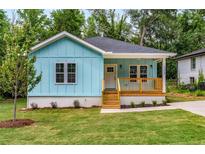 Charming light blue bungalow with a cozy front porch and newly landscaped front yard at 1317 Bernard Nw St, Atlanta, GA 30314