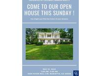 Inviting two-story home with a spacious front yard, perfect for entertaining this Sunday during our open house event at 5290 River Mill Cir, Marietta, GA 30068