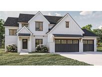 Charming two-story home featuring a white brick facade, black trim windows, and a two-car garage with carriage doors at 3629 Centerville Rosebud Rd, Snellville, GA 30039