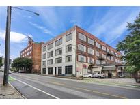 Brick exterior of building featuring large windows and street view showcasing the building's urban location at 434 Marietta St Nw # 401, Atlanta, GA 30313