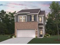 Charming two-story home with a brick and gray facade, attached two car garage, and lush front lawn at 1878 Copelyn Reese Court (Lot 169), Lawrenceville, GA 30043