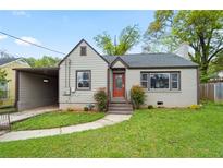 Charming bungalow-style home featuring a cozy front yard and a convenient carport at 664 Florence Nw Pl, Atlanta, GA 30318