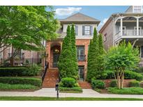 Charming brick home with manicured landscaping, mature trees and inviting curb appeal at 1220 State Nw St, Atlanta, GA 30318