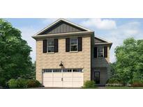 Charming two-story home with a brick facade, attached garage, and well-maintained landscaping at 6131 Knickerbocker St, Mableton, GA 30126