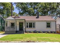 Charming single-story home featuring a covered front porch, well-maintained lawn, and classic curb appeal at 139 Sisson Ne Ave, Atlanta, GA 30317