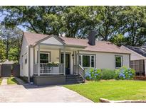 Charming bungalow featuring a cozy front porch, landscaped garden, and classic architectural details at 139 Sisson Ne Ave, Atlanta, GA 30317