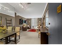 Inviting living room with dining area, comfortable seating, and lots of natural light at 1421 Peachtree Ne St # 212, Atlanta, GA 30309