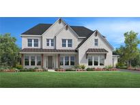 Charming two-story home with white brick, black roof, a well-manicured lawn, and beautiful landscaping at 4975 Travers Ln, Cumming, GA 30040