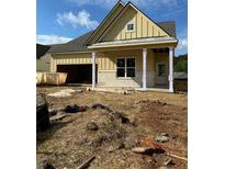 New construction home featuring a covered porch with columns, stone accents, and an attached garage at 2004 Homestead Ct, Woodstock, GA 30189