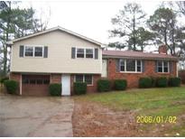 Charming two-story home featuring a brick facade, attached garage, and well-maintained landscaping at 401 Mount Tabor Church Rd, Dallas, GA 30157