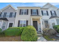 Charming townhouse featuring a well-manicured lawn and classic architectural details at 6540 Arbor Gate Sw Dr # 3, Mableton, GA 30126