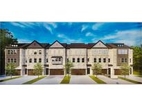 Brick townhomes with attached garages feature a classic architectural style and manicured landscaping at 1161 Dahlonega Hwy # 9, Cumming, GA 30040