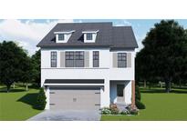 Charming two-story home featuring a gray garage door, dormer windows and neutral-toned shutters at 4554 Eastbrook Pl, Snellville, GA 30039