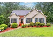 Charming one story home with manicured lawn, colorful landscaping, and inviting front entrance at 4544 Dorsett Shoals Run, Douglasville, GA 30135