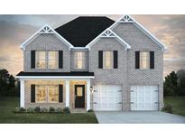 Beautiful two-story home with gray brick, a two-car garage, and black shutters at 1669 Fuma Leaf Way, Mcdonough, GA 30253