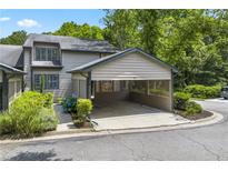 Charming townhome featuring a covered carport and manicured landscaping at 500 Gardenia Ln, Marietta, GA 30068