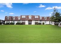 Attractive building with well-manicured lawn and beautiful architecture and neutral exterior color palette at 12 Rue Fontaine, Lithonia, GA 30038