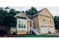 Charming two-story home features a two car garage, stairs to the front door, and a well-manicured lawn at 2193 Kildare Nw Way, Kennesaw, GA 30152