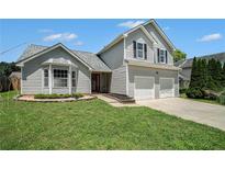 Charming two-story home features a well-manicured lawn and a two-car garage at 4578 Score Ct, Snellville, GA 30039