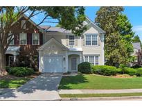 Charming two-story home with a well-manicured lawn and attached one car garage at 2907 Timbercreek Cir, Roswell, GA 30076