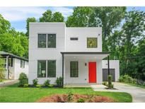 Modern white two-story home featuring a bright red front door and lush green lawn at 2926 5Th Sw St, Atlanta, GA 30315
