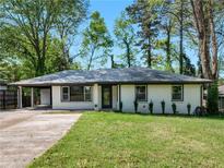 Charming renovated ranch-style home with fresh exterior paint and well-manicured lawn at 2903 Monterey Dr, Decatur, GA 30032