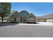 Inviting one-story home with brick and siding, complemented by a manicured lawn and charming curb appeal at 223 Glens Loop, Woodstock, GA 30188