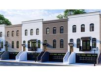 Row of townhomes with varying brick colors and garage doors at 343 Sugarview Rd, Sugar Hill, GA 30518