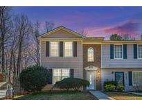 Charming two-story townhome with a well-maintained front yard and inviting entrance at 4211 Wingfoot Ct, Decatur, GA 30035