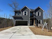 Charming two-story home with attached garage and new concrete driveway at 5518 Legacy Trl, Douglasville, GA 30135
