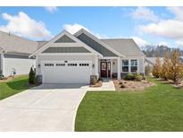 Charming home with a well-manicured lawn, two-car garage, and inviting front entrance at 41 Balsam Dr, Dallas, GA 30157
