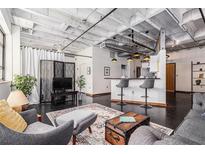 Bright living room showcasing an open floor plan, with modern decor and a comfortable seating area at 878 Peachtree Ne St # 634, Atlanta, GA 30309