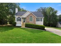 Charming home features a well-manicured lawn, stone accents, and a cozy entrance at 71 Headland Ct, Rockmart, GA 30153