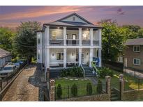 Charming two-story home with a double-decker porch and well-manicured front yard at 918 Washington Sw St, Atlanta, GA 30315