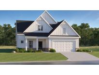 Charming home with a two-car garage, black roof, neat landscaping, and a covered front porch at 4 Unicoi Trl, Sharpsburg, GA 30277