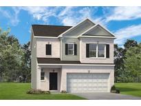 Charming two-story home featuring a brick facade, attached two-car garage, and well-maintained landscaping at 1205 Elowen Dr, Austell, GA 30168