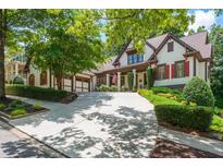Charming home with a manicured lawn, inviting driveway and a two-car garage at 9967 Devonshire St, Douglasville, GA 30135